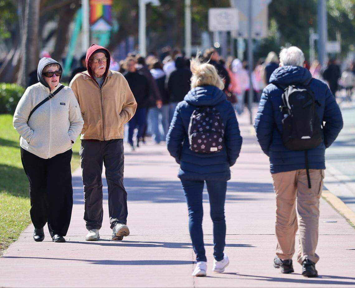 People walk, dine, and visit the beach as a cold snap descends on S. Florida during their visit to Miami Beach’s Art Deco District.Temperatures in South Florida dipped overnight as the polar vortex brought an Arctic blast and cold air. With a high of 56 degrees, residents and visitors swapped shorts, bikinis, and activewear for hoodies, sweaters, and jackets on Sunday, February 1, 2026, in Miami Beach, Florida.