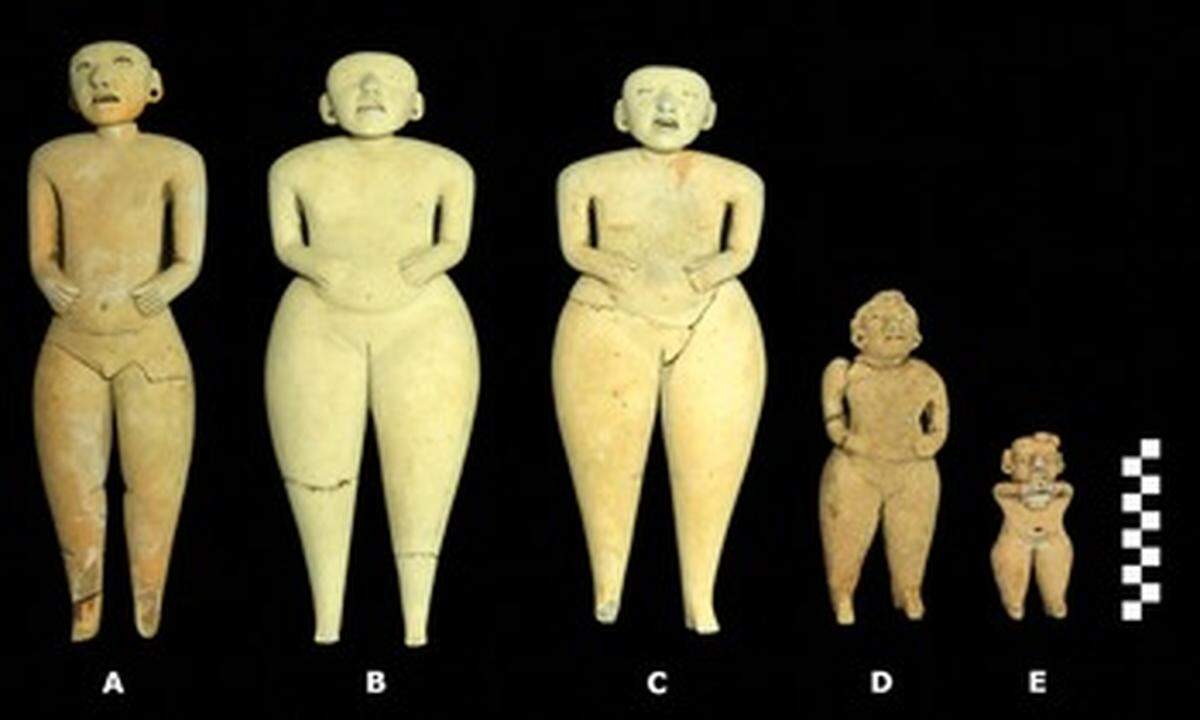 Five figures of varying size, including one male, were found on top of a large pyramid.