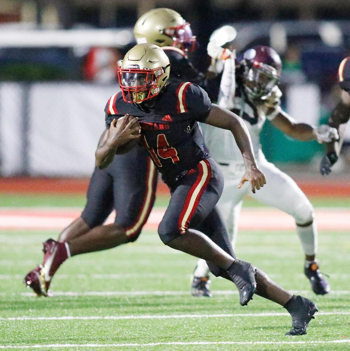 Monsignor Pace Spartans running back Adam Roger (14) carries the ball against Norland Vikings during football game on Friday, September 16, 2022 at Monsignor Pace HS in Miami. Andrew Uloza / for Miami Herald