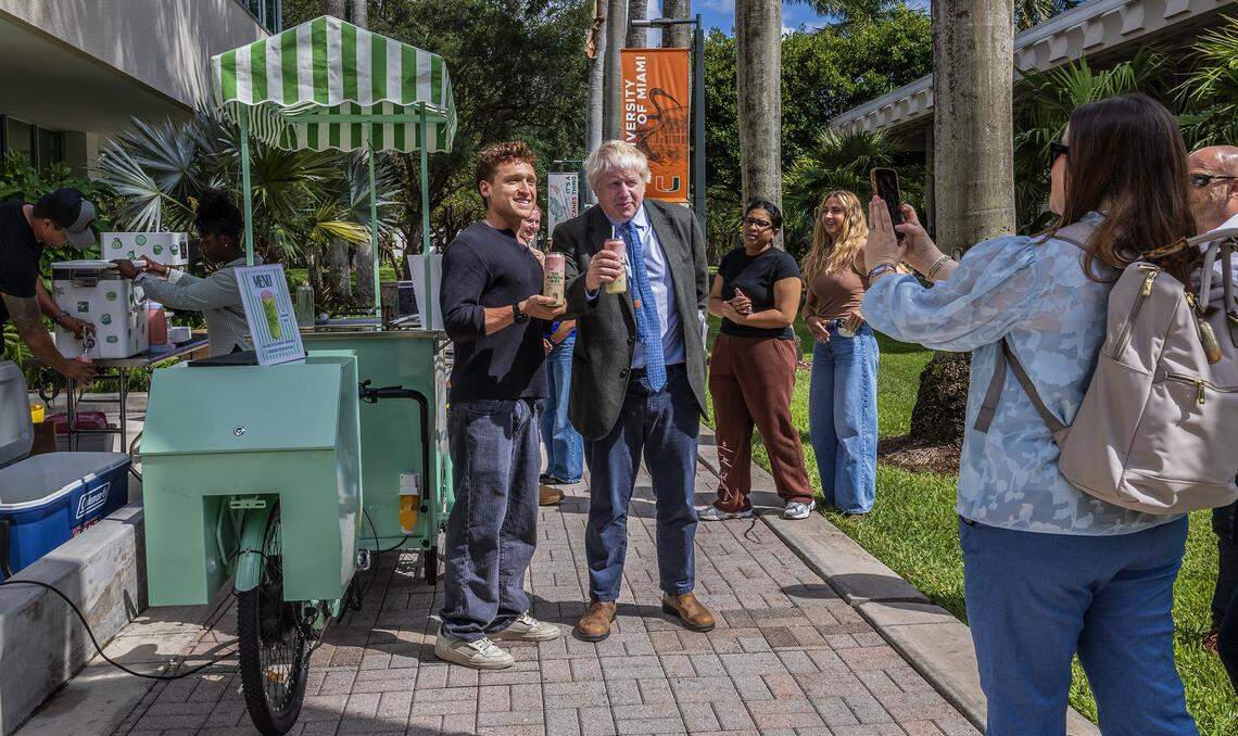 Grad student Sam Sachs (left) shares a Matcha Bike drink with Former Great Britain Boris Johnson who joined the University of Miami as a Provost's Visiting Lecturer and Distinguished Arts & Sciences Scholar, for the Spring 2022, on Wednesday, April 22, 2026.