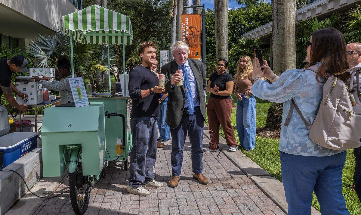 Grad student Sam Sachs (left) shares a Matcha Bike drink with Former Great Britain Boris Johnson who joined the University of Miami as a Provost's Visiting Lecturer and Distinguished Arts & Sciences Scholar, for the Spring 2022, on Wednesday, April 22, 2026.