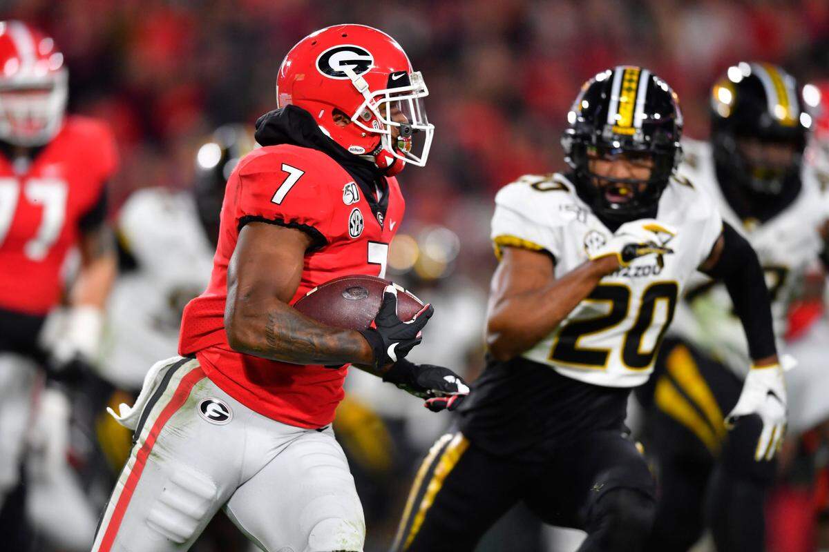 FILE - In this Nov. 9, 2019, file photo, Georgia running back D’Andre Swift runs as Missouri defensive back Khalil Oliver (20) defends during an NCAA college football game in Athens, Ga. Swift is one of the top running backs in the upcoming NFL draft. (AP Photo/John Amis, File)