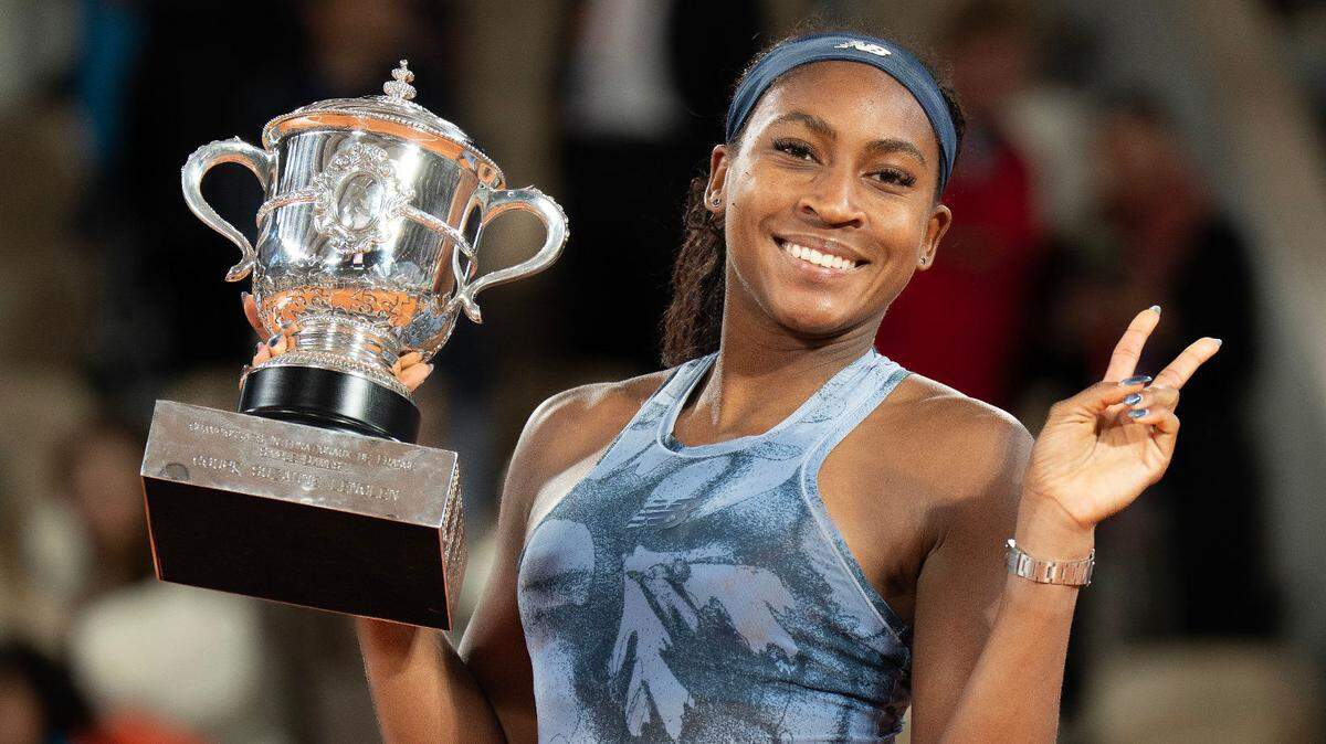 Jun 7, 2025; Paris, FR; Coco Gauff of the United States poses with the trophy after winning the womenÕs singles final against Aryna Sabalenka on day 14 at Roland Garros Stadium. Mandatory Credit: Susan Mullane-Imagn Images