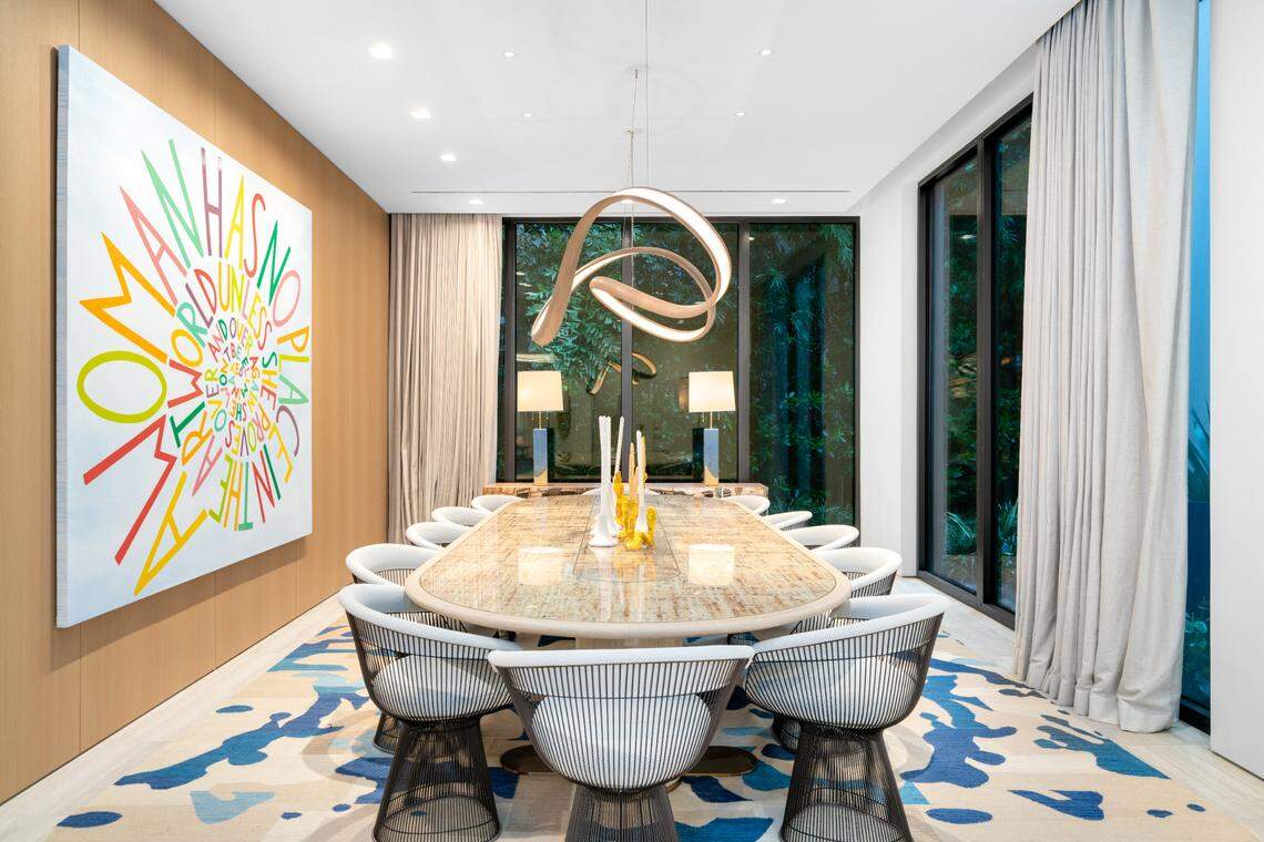 Miami Beach’s North Bay Road has long attracted the rich and famous. Over the past few decades, actor Matt Damon, singer and actress J.Lo, and former Miami Heat player Dwayne Wade have lived in the neighborhood. Above: In addition to the breakfast table in the kitchen, the home also has a formal dining room.