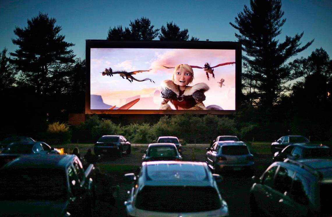 Movie-goers watch “How to Train Your Dragon 2,” at the Saco Drive-In in Saco, Maine. A drive-in theater will be opening soon in North Miami, outside Dezerland Park, the largest indoor theme park in the region.