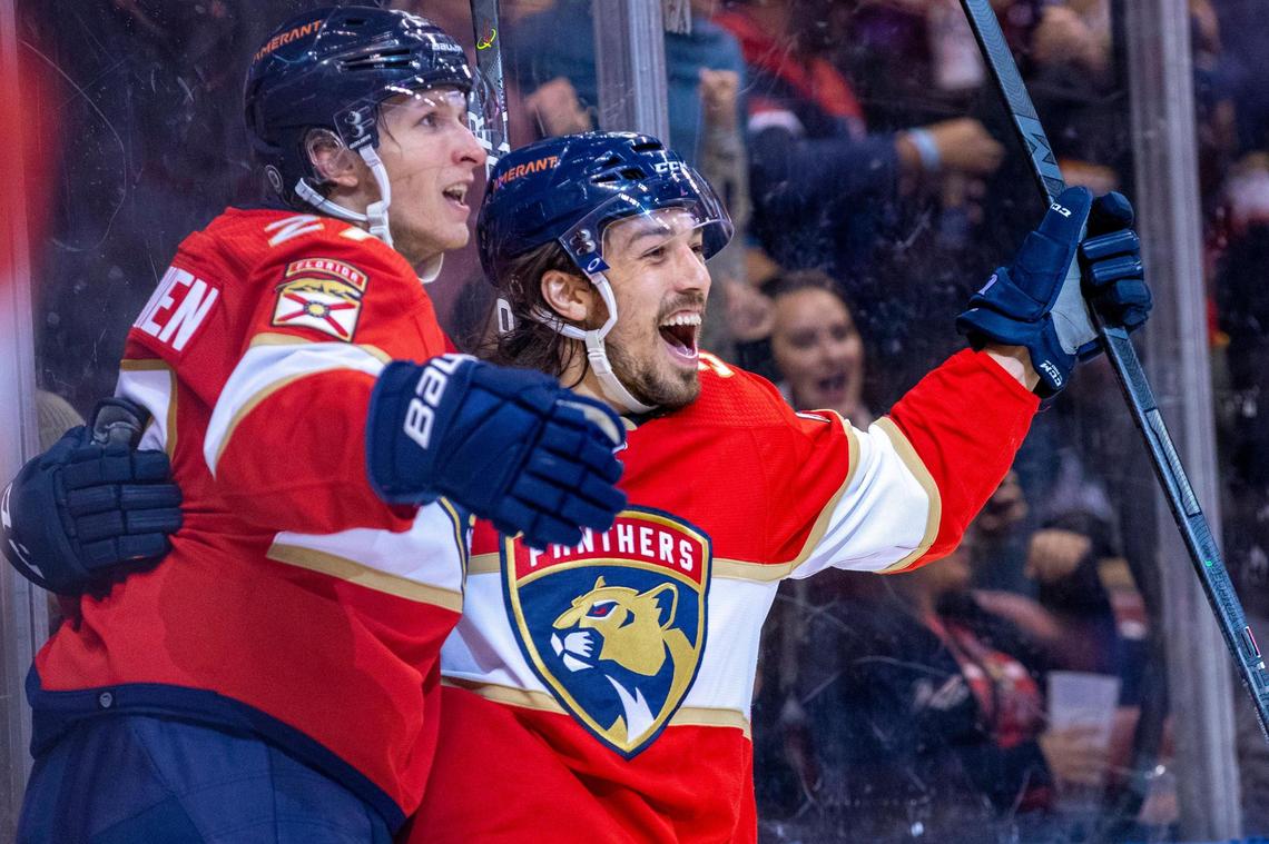 Ryan Lomberg, right, celebrates after scoring late in the second period to give the Panthers a two-goal lead.