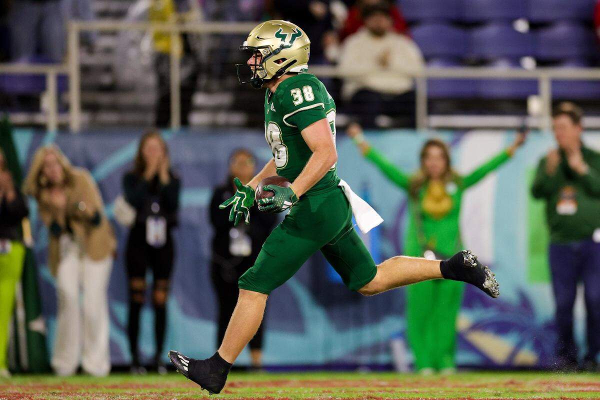 Dec 21, 2023; Boca Raton, FL, USA; South Florida Bulls wide receiver Sean Atkins (38) catches a pass for a touchdown against the Syracuse Orange in the third quarter during the RoofClaim.com Boca Raton Bowl at FAU Stadium. Mandatory Credit: Nathan Ray Seebeck-USA TODAY Sports