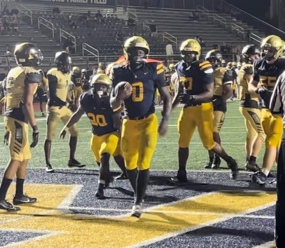 St. Thomas Aquinas running back Stacey Gauge scores this 1-yard touchdown to help the Raiders open a 33-0 lead during their 42-6 win over Treasure Coast on Friday night at Aquinas.