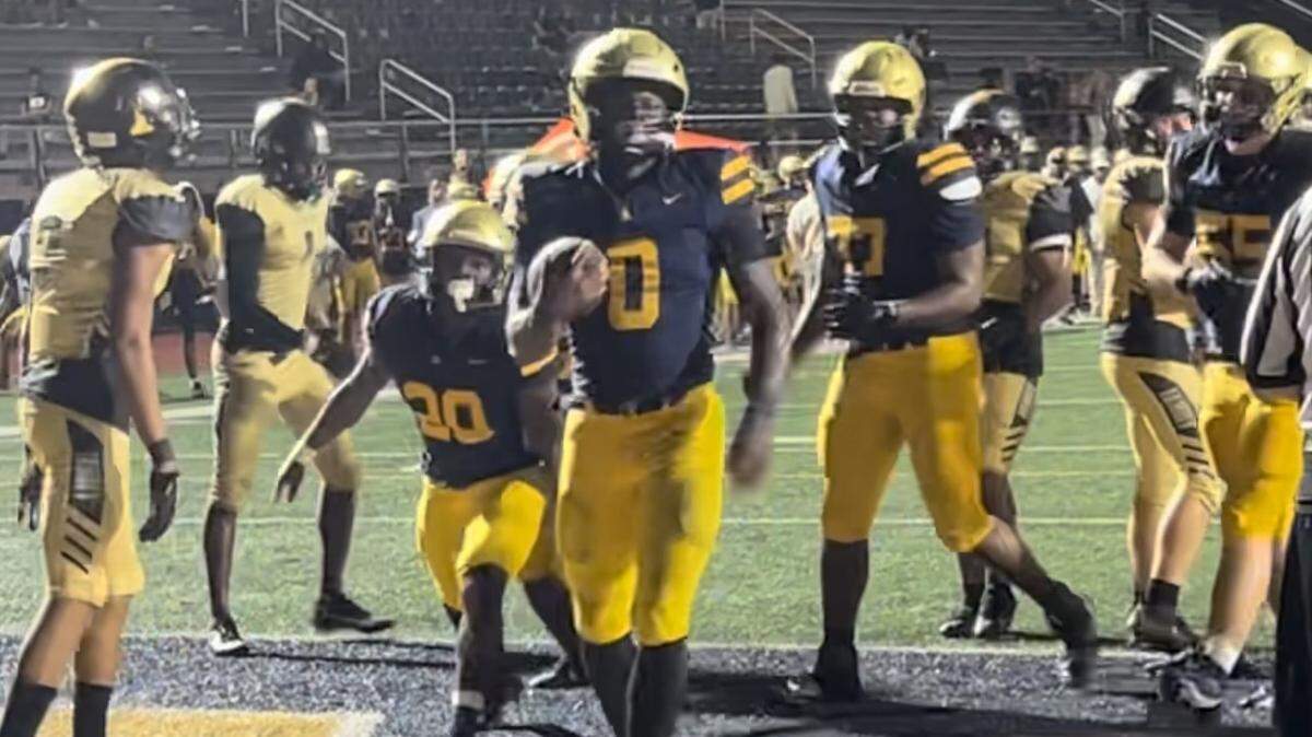 St. Thomas Aquinas running back Stacey Gauge scores this 1-yard touchdown to help the Raiders open a 33-0 lead during their 42-6 win over Treasure Coast on Friday night at Aquinas.