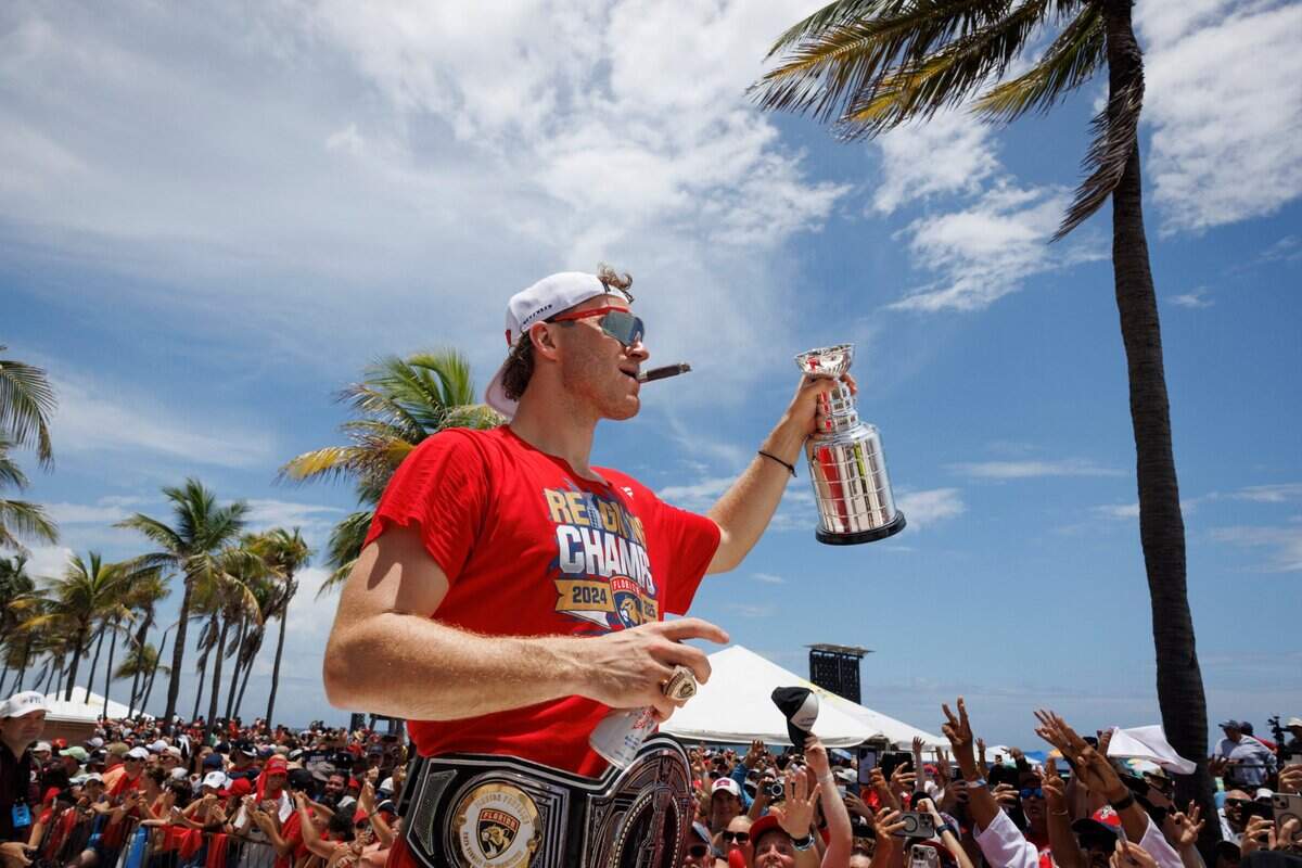 Florida Panthers left wing Matthew Tkachuk (19) waves to fans during the Florida Panthers Stanley Cup Championship victory parade on Sunday, June 22, 2025 down Las Olas in Fort Lauderdale, Fla.