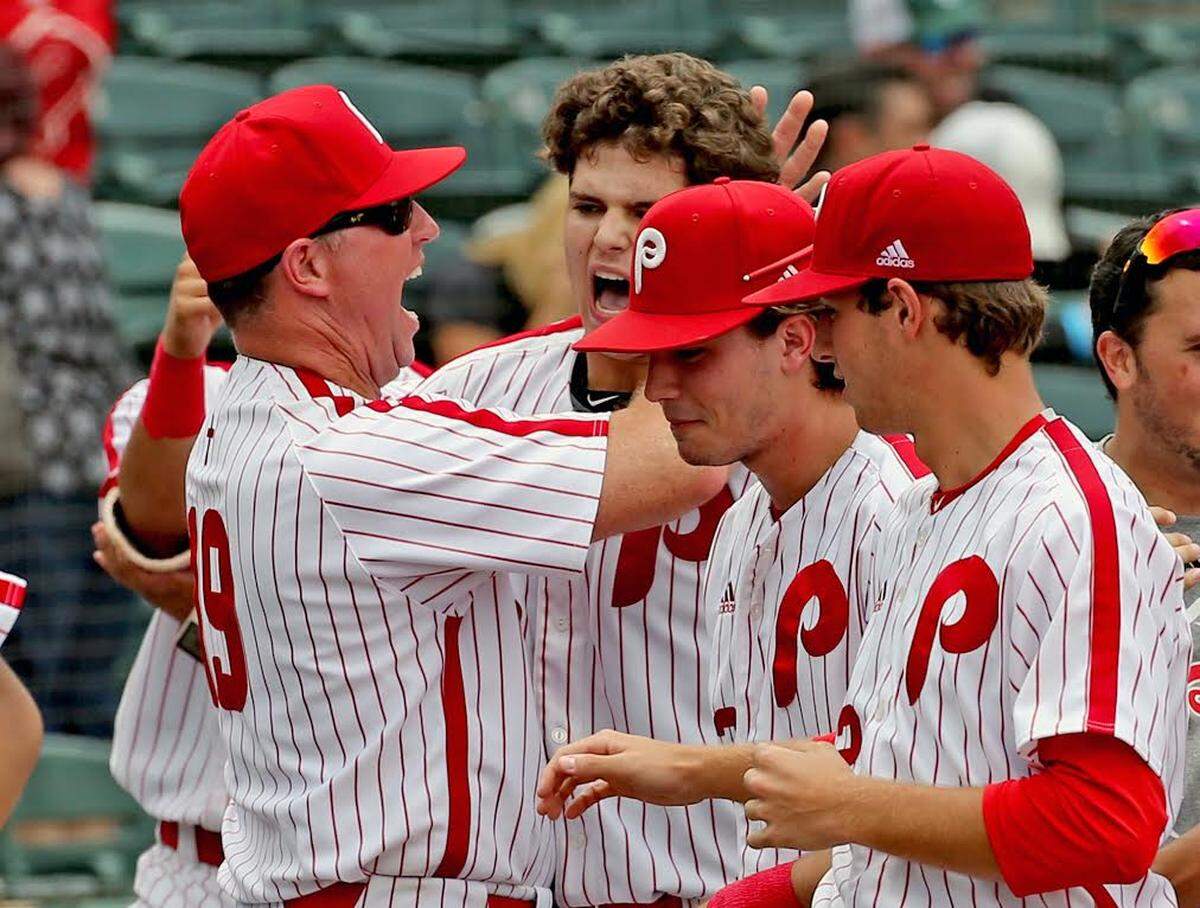 Monsignor Pace head coach Tom Duffin screams at Victor Mederos (52) after his second inning home run as they play Avon Park HS in the 5A Semifinals of the FHSSA Baseball Championships in Fort Myers, Florida, May 31, 2018.