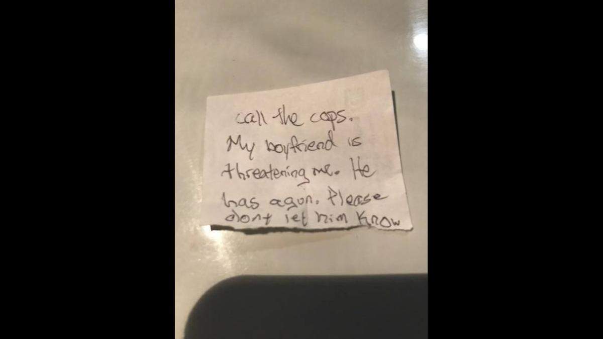 A woman passed workers a note at a veterinarian office that read: “Call the cops. My boyfriend is threatening me. He has a gun. Please don’t let him know.”