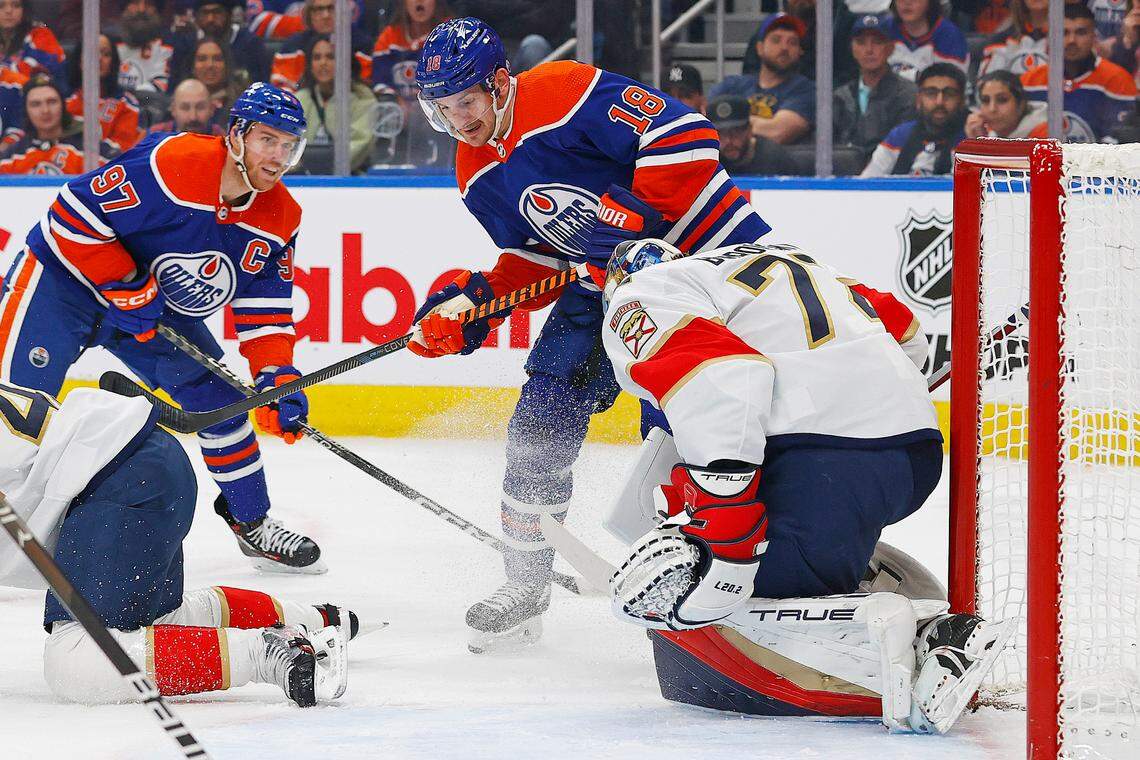 Dec 16, 2023; Edmonton, Alberta, CAN; Edmonton Oilers forward Zach Hyman (18) and forward Connor McDavid (97) looks for a loose puck in front of Florida Panthers goaltender Sergei Bobrovsky (72) during the first period at Rogers Place. Mandatory Credit: Perry Nelson-USA TODAY Sports