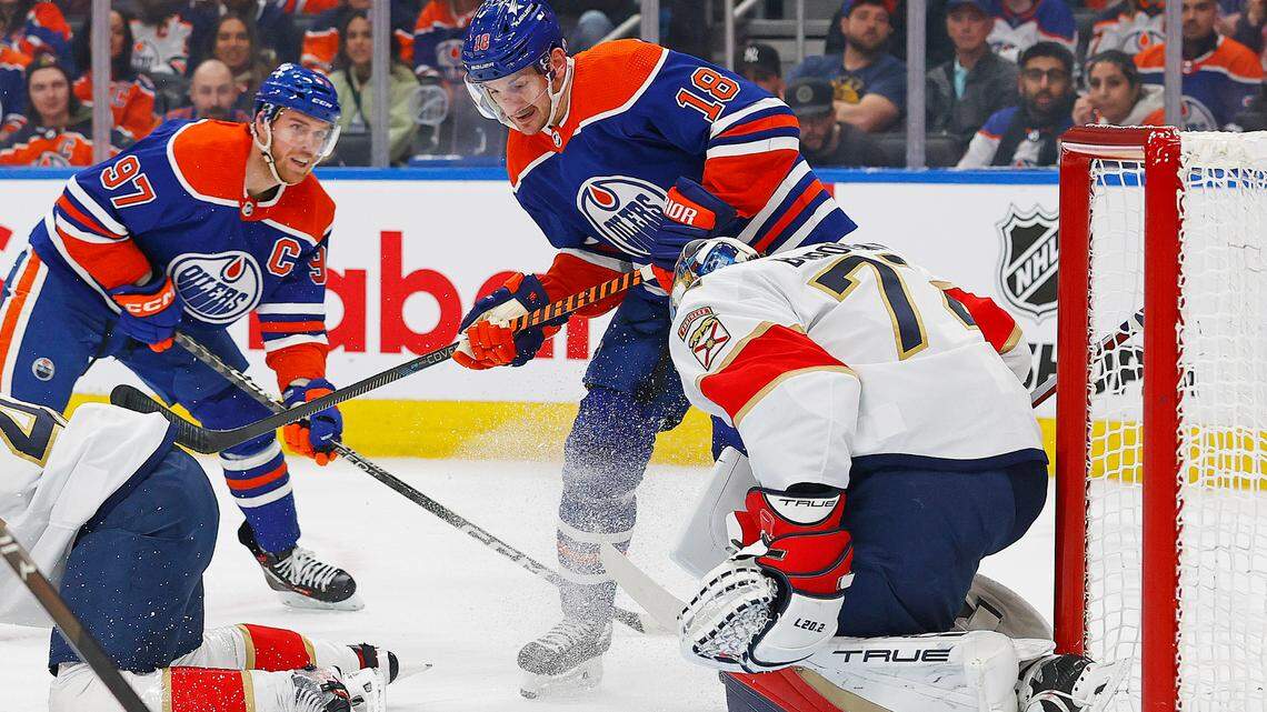 Dec 16, 2023; Edmonton, Alberta, CAN; Edmonton Oilers forward Zach Hyman (18) and forward Connor McDavid (97) looks for a loose puck in front of Florida Panthers goaltender Sergei Bobrovsky (72) during the first period at Rogers Place.