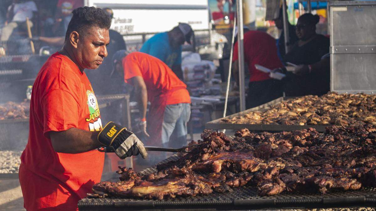 A vendor grills jerk chicken at a previous Grace Jamiacan Jerk Festival.