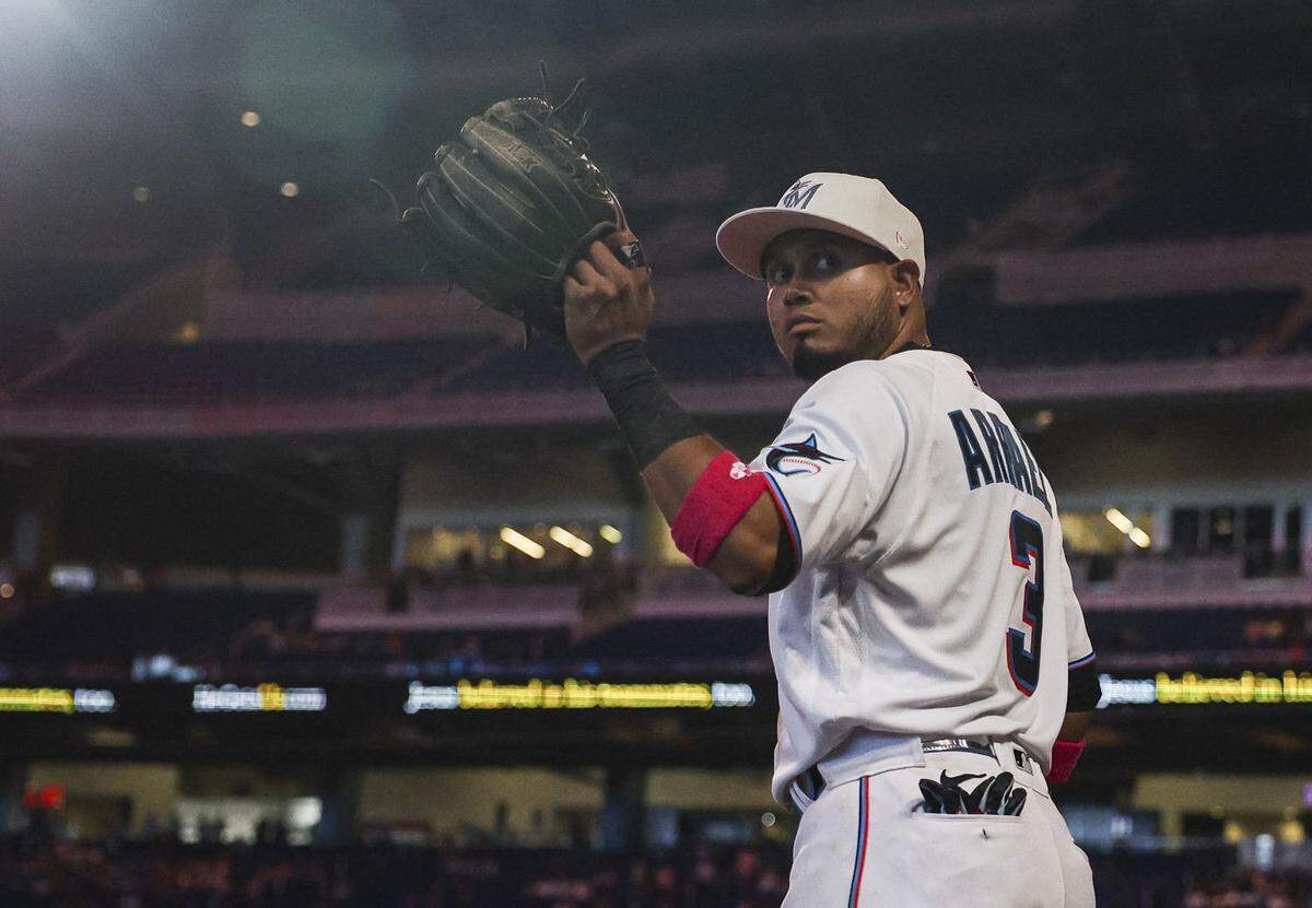 Miami Marlins second baseman Luis Arraez (3) waves to fans as he steps on the field during the eighth inning of a baseball game against the Cincinnati Reds on Sunday, May 14, 2023, at loanDepot Park in Miami.