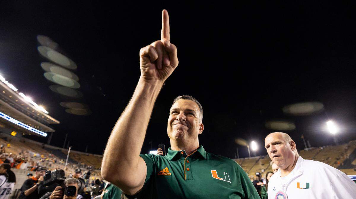 Miami Hurricanes head coach Mario Cristobal points towards fans after his team defeated the California Golden Bears in their NCAA college football game at the California Memorial Stadium on Saturday, Oct. 5, 2024, in Berkeley, Calif.