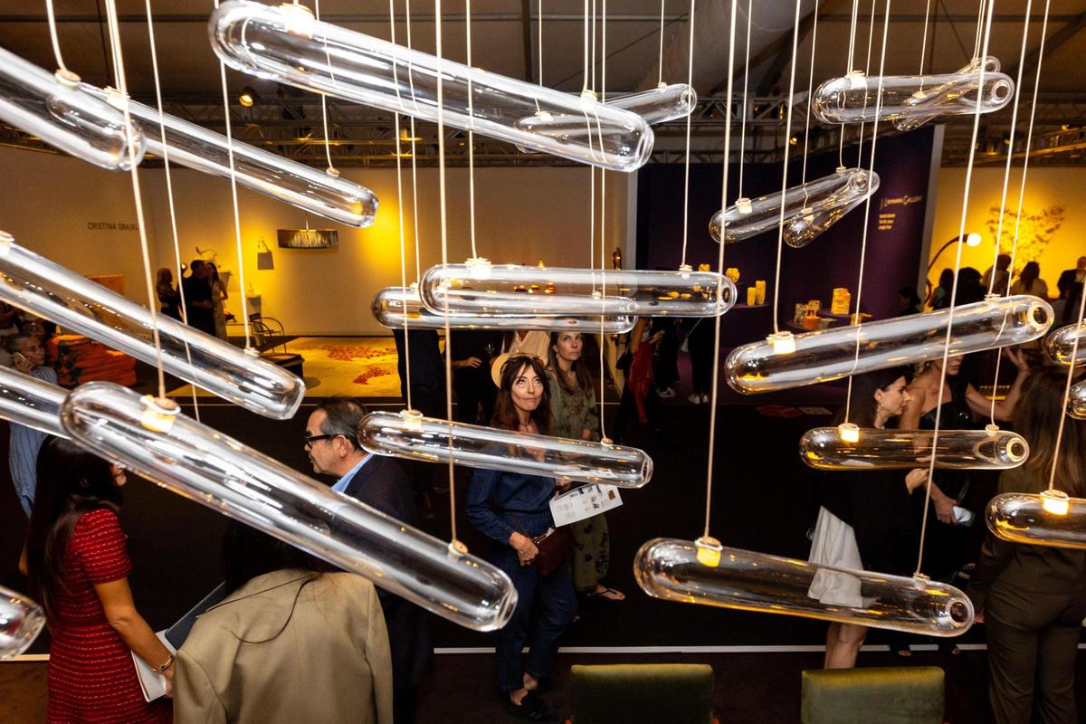 Guests wander around during the VIP opening of Design Miami for Art Basel in Miami Beach, Florida, on Tuesday, December 5, 2023.