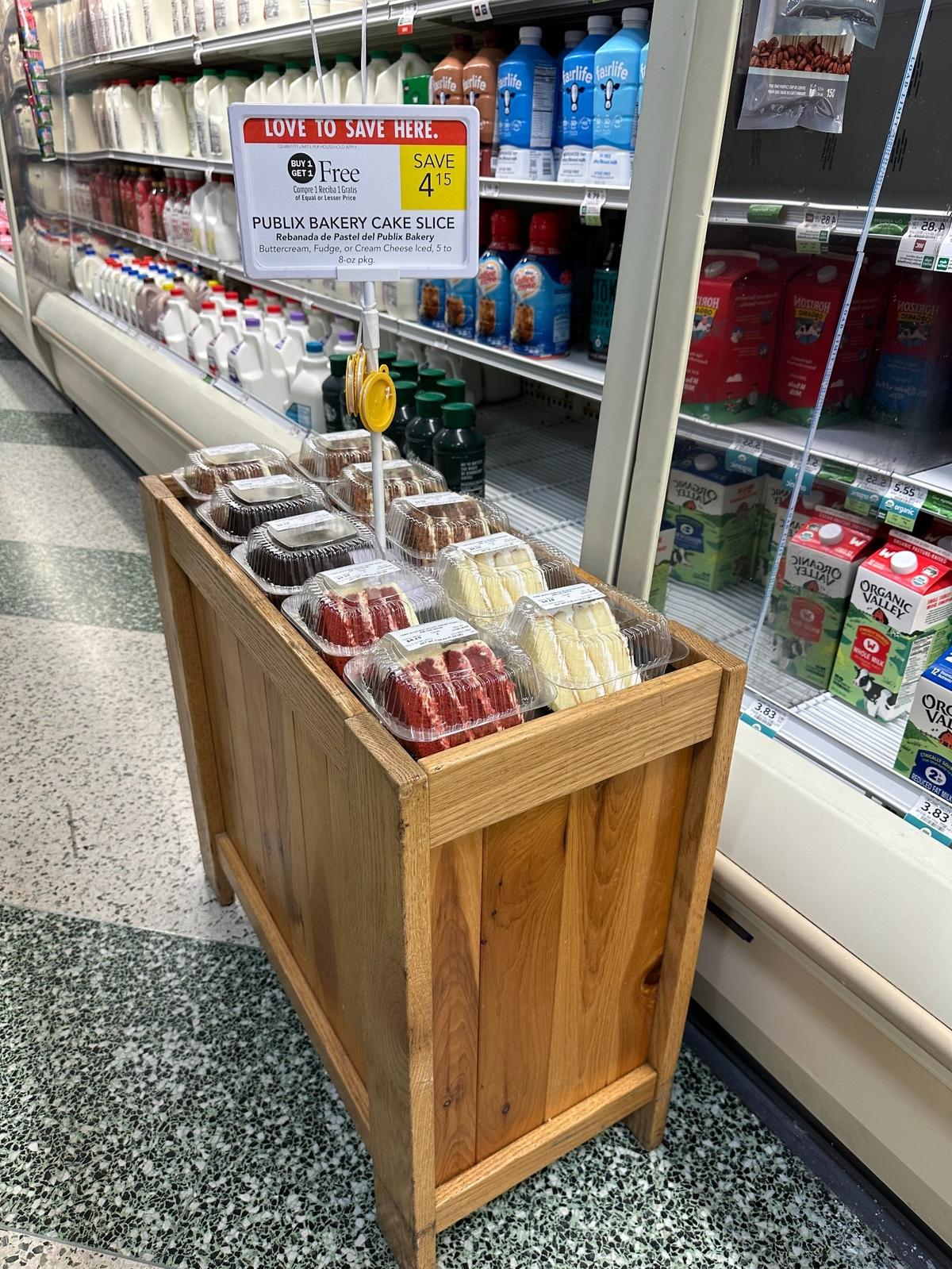 A display of Publix Bakery Cake slices that are on BOGO sale through Jan. 22, 2025, are seen in the dairy aisle at the Coral Gables Publix on Le Jeune Road on Jan. 21, 2025. There were displays in several locations at the store.