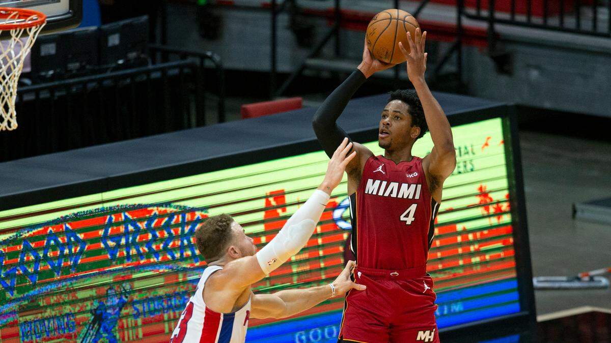 Miami Heat forward KZ Okpala (4) shoots over Detroit Pistons forward Blake Griffin (23) in the first quarter of a NBA basketball game at AmericanAirlines Arena on Jan. 16, 2021.