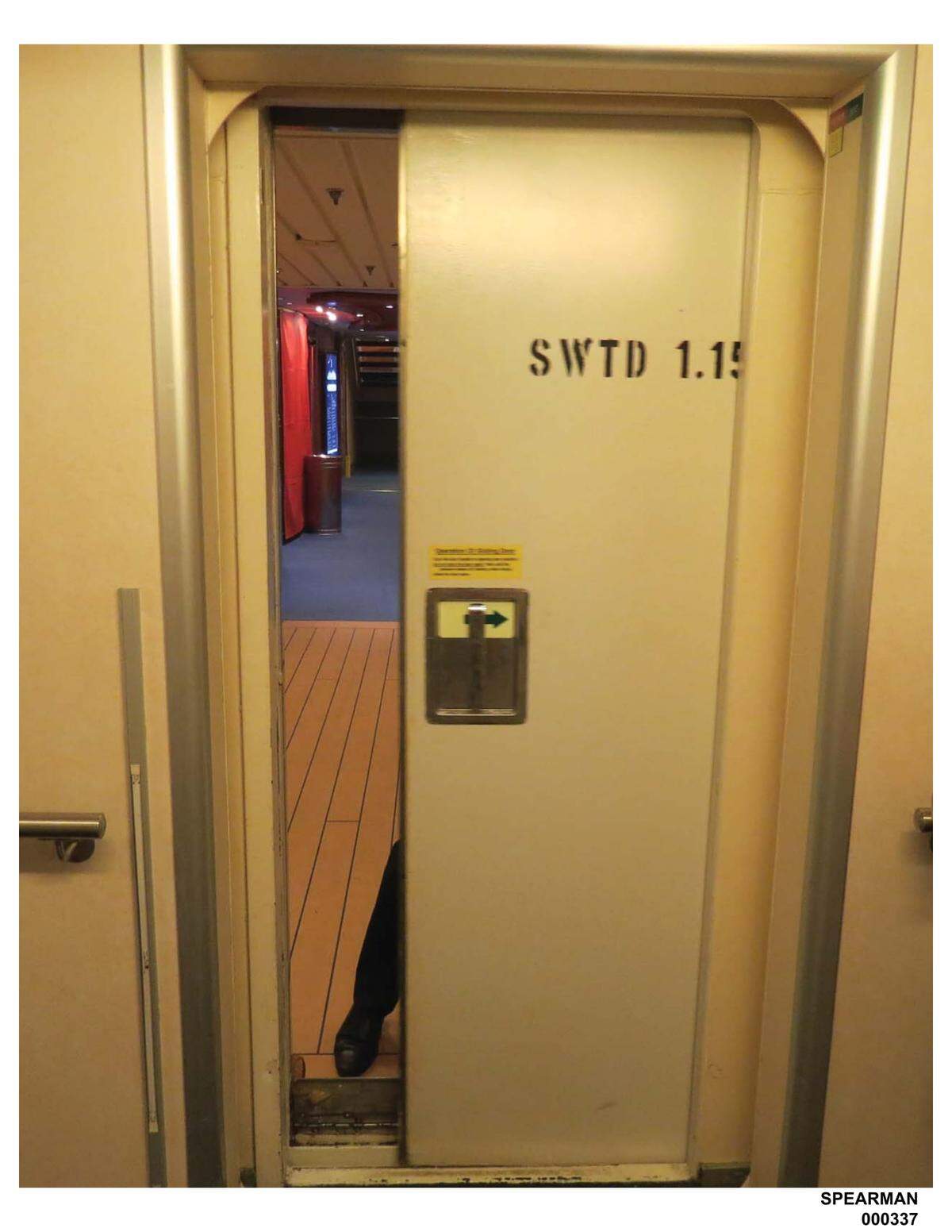 The door that crushed Spearman's hand on Voyager of the Seas. Lisa Spearman tried to keep the door open for a colleague by holding open the handle, but the door slid back quickly, severely injuring her.