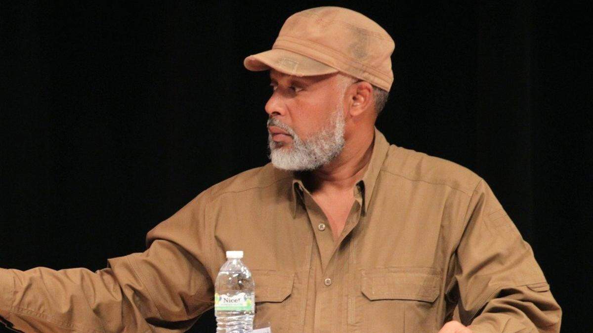 In this file photo, former Haitian presidential candidate Eric Jean-Baptiste participated in a live presidential debate of the Haitian Diaspora 2015 Electoral Forum at North Miami High School auditorium in Florida on Sunday, Oct. 4, 2015.