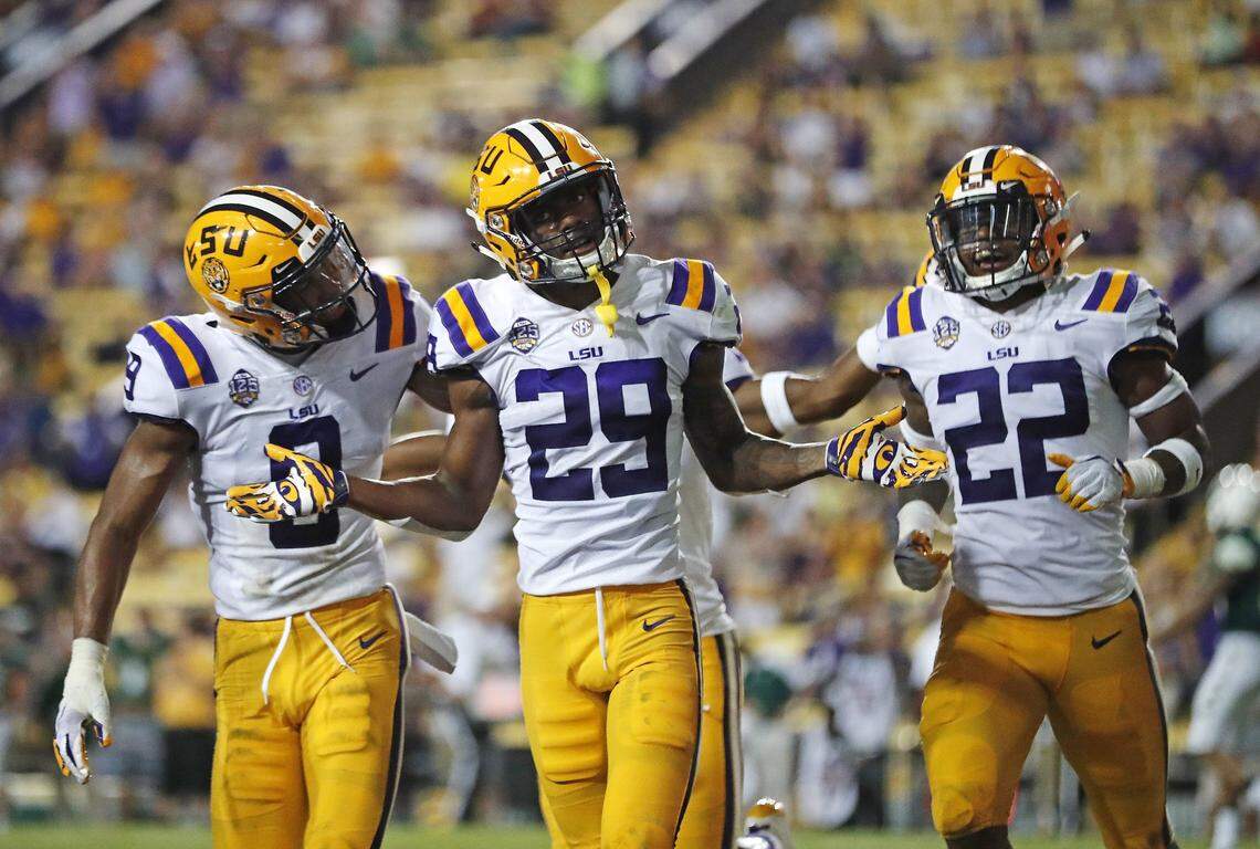 LSU cornerback Greedy Williams (29) celebrates his interception with safety Grant Delpit (9) and cornerback Kristian Fulton (22) in the second half of an NCAA college football game against Southeastern Louisiana in Baton Rouge, La. LSU leads the nation with 14 interceptions.