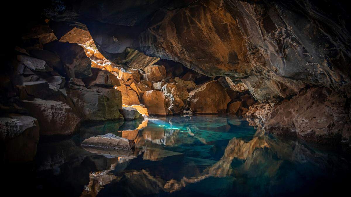 In the clear water of Totem Pole Cave (not pictured), “giant” creatures swim around, waiting to be discovered.