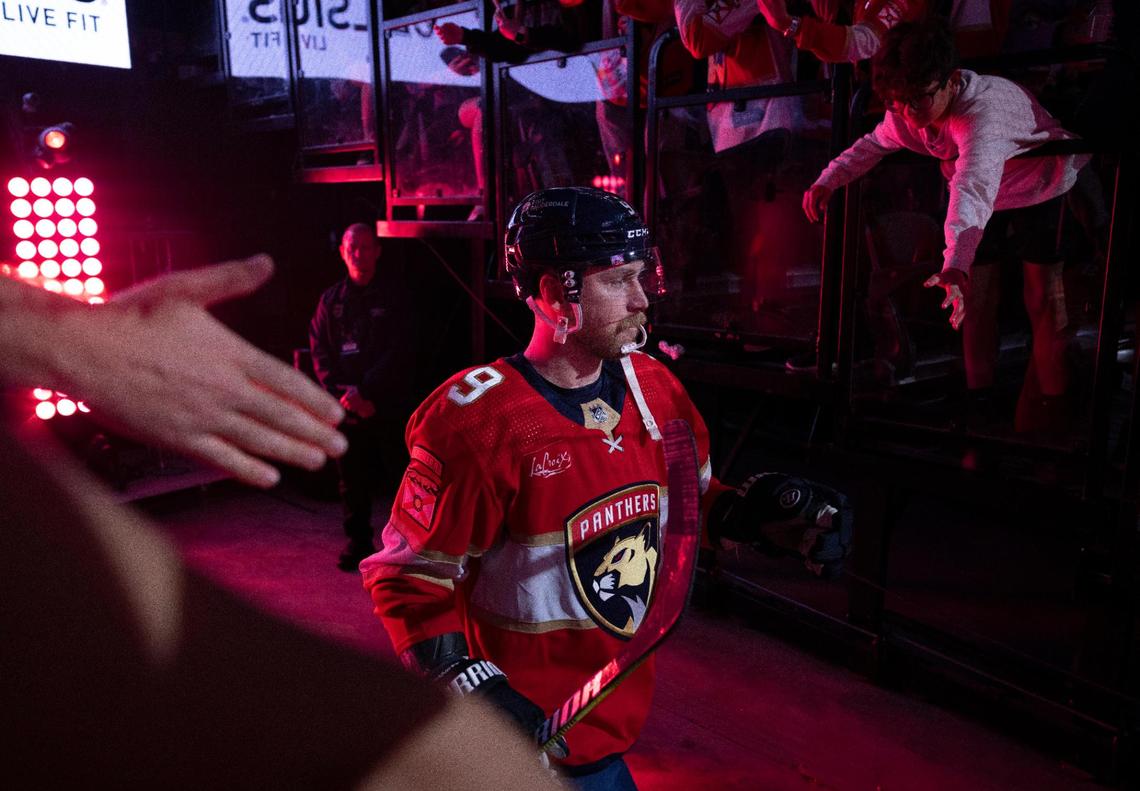 Florida Panthers center Sam Bennett (9) walking onto the ice as he high fives fans before an NHL game against the Chicago Blackhawks at the Amerant Bank Arena on Sunday, Nov 12, 2023, in Sunrise, Fla.