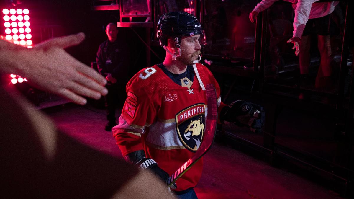 Florida Panthers center Sam Bennett (9) walking onto the ice as he high fives fans before an NHL game against the Chicago Blackhawks at the Amerant Bank Arena on Sunday, Nov 12, 2023, in Sunrise, Fla.
