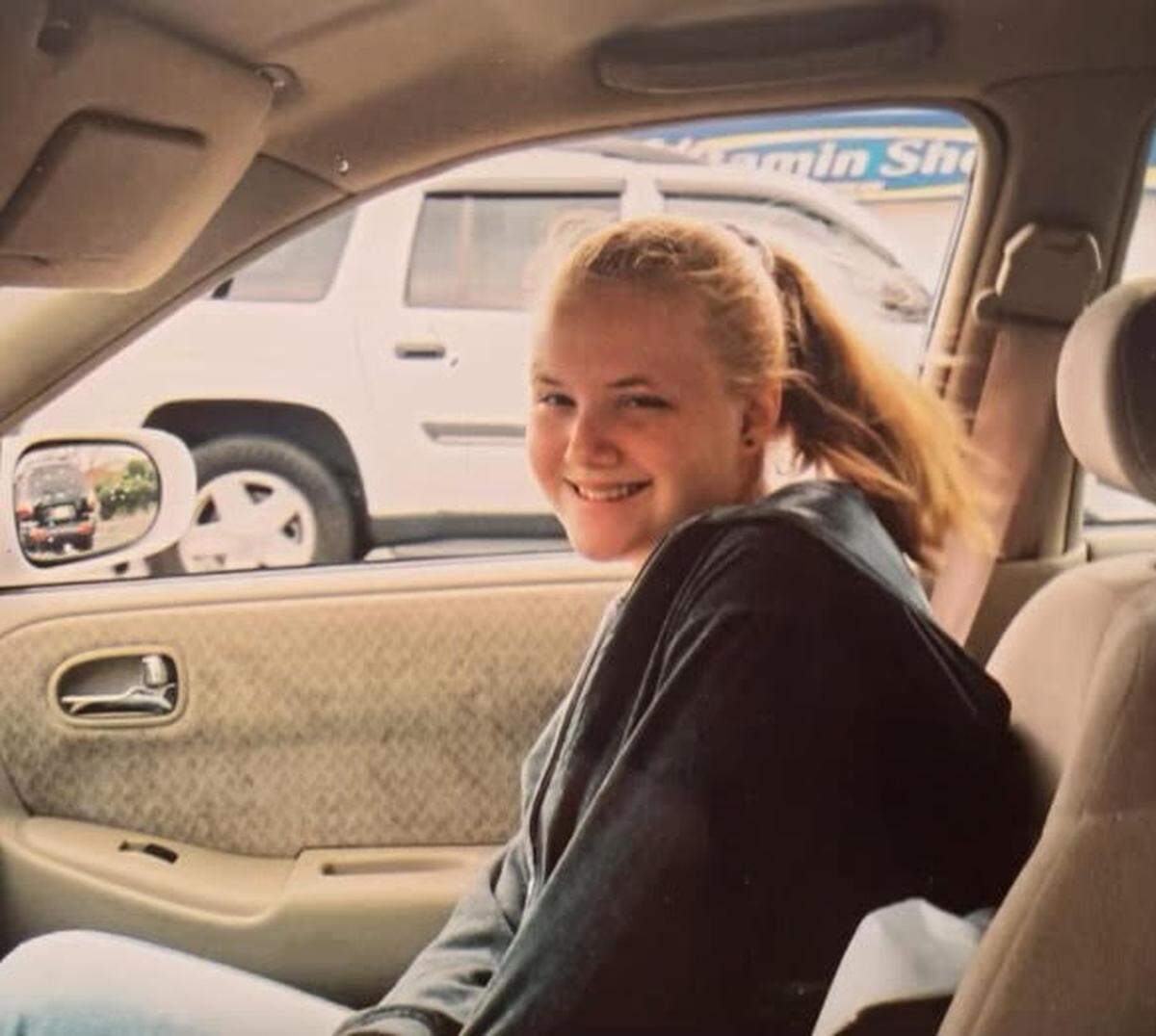 Tara Rosado sits in a car in this undated photo provided by her family.