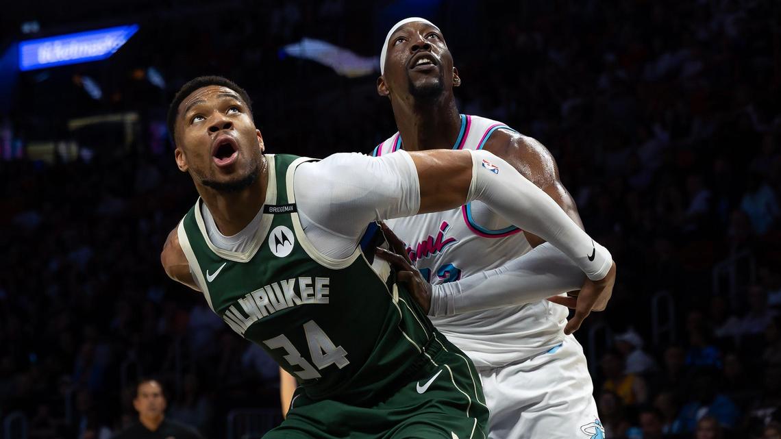 Milwaukee Bucks forward Giannis Antetokounmpo (34) and Miami Heat center Bam Adebayo (13) battle for position under the basket during the first half of their game at Kaseya Center in Miami on April 5, 2025.