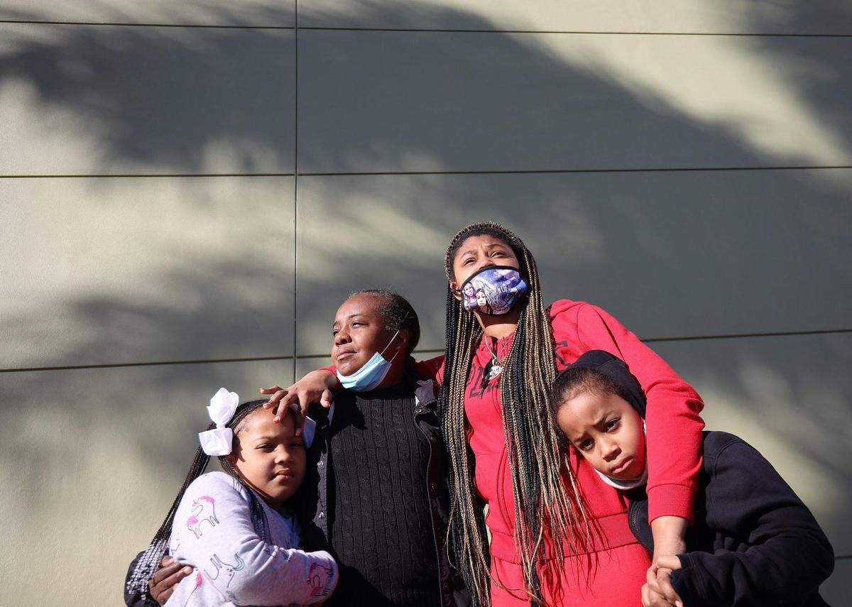 Jackie Hall, second from left, is the legal guardian of Ja’Dore Myles, 9, left, Ka’Mora McKenzie, 13, and Ja’Quevin Myles Jr., 8. The three are the surviving children of Sally Aponte, Hall’s stepdaughter, who was killed in September due to gun violence.