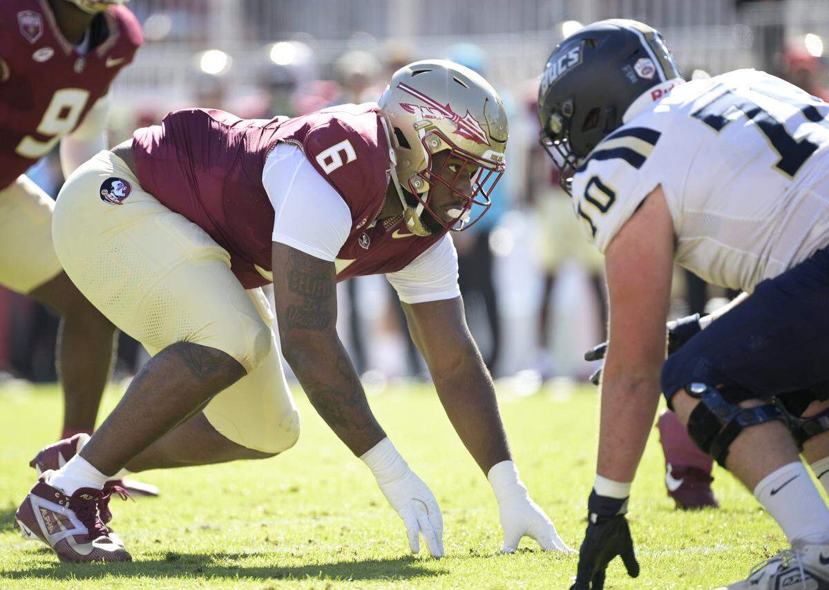 Nov 23, 2024; Tallahassee, Florida, USA; Florida State Seminoles defensive lineman Darrell Jackson Jr. (6) prepares for the snap during the first quarter against the Charleston Southern Buccaneers at Doak S. Campbell Stadium. Mandatory Credit: Melina Myers-Imagn Images