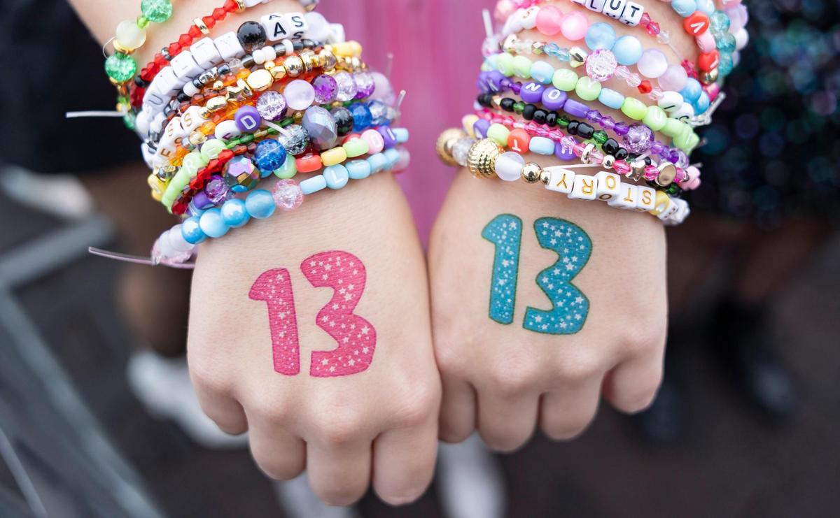 A fan shows her friendship bracelets as they arrive to Hard Rock Stadium to watch Taylor Swift’s The Eras Tour on Friday, Oct.18, 2024, in Miami Gardens, Fla.