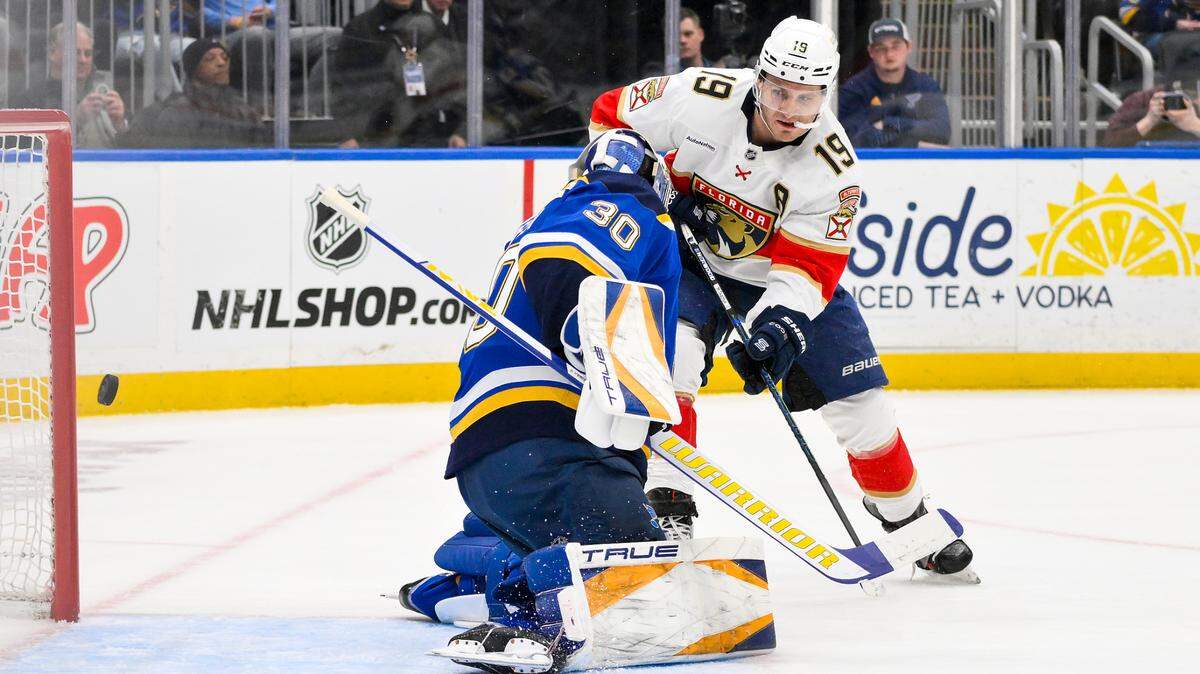 Feb 6, 2025; St. Louis, Missouri, USA; Florida Panthers left wing Matthew Tkachuk (19) scores against St. Louis Blues goaltender Joel Hofer (30) during the first period at Enterprise Center.