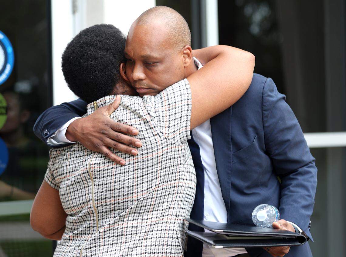Broward College President Greg Haile hugs a woman after leaving a Board of Trustees meeting at Broward College south campus in Pembroke Pines on Tuesday, September 26, 2023. Haile submitted his resignation two weeks ago. (Carline Jean/South Florida Sun Sentinel)
