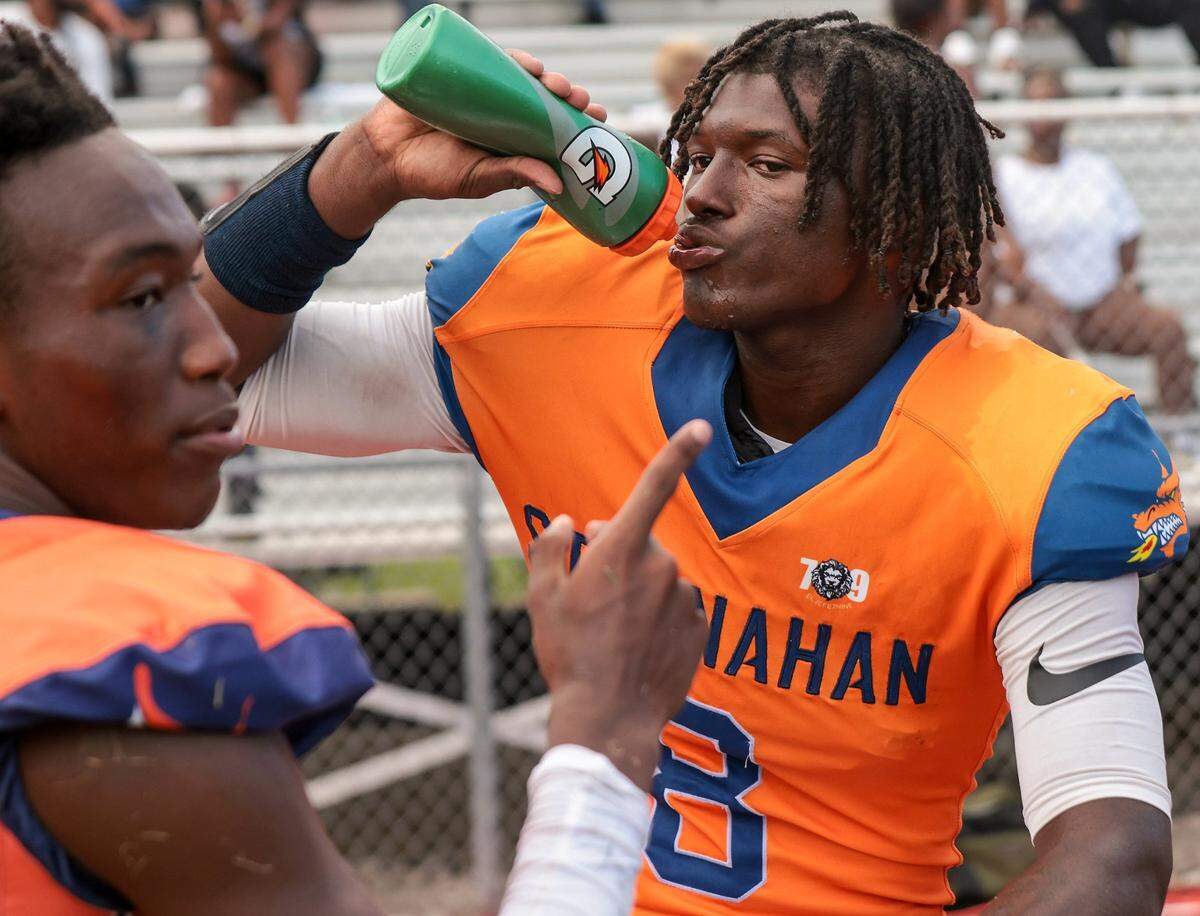 Stranahan football player Hykeem Williams takes a water break during game against Western High on Thursday, August 25, 2022.