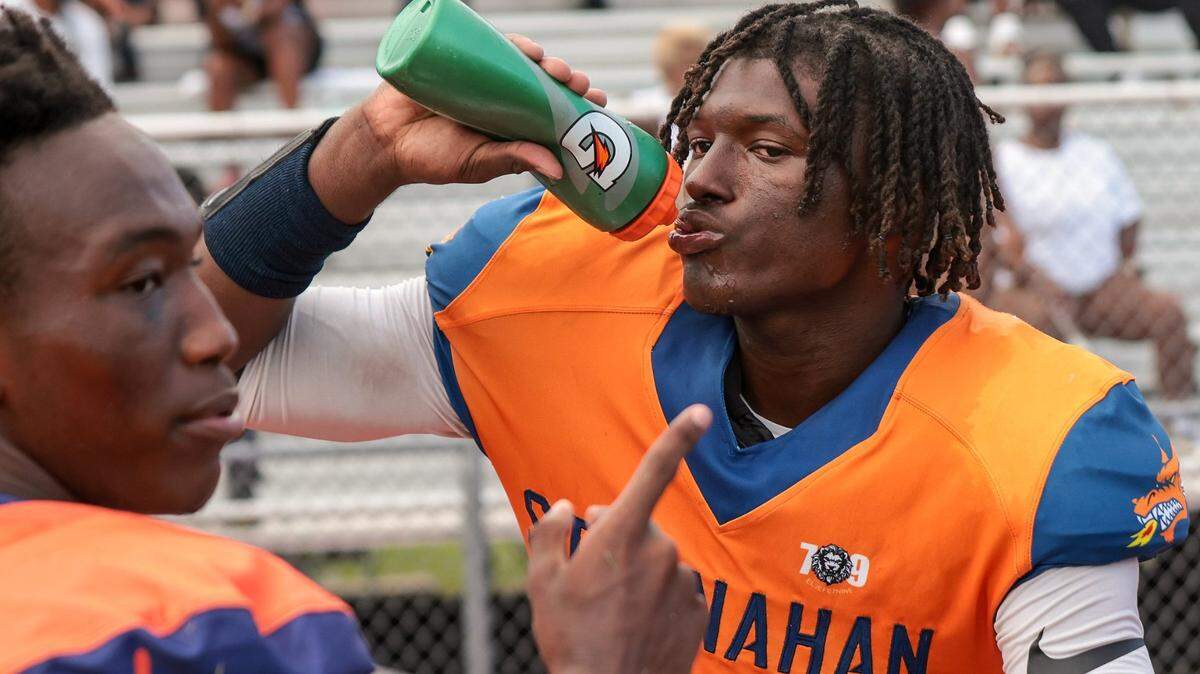 Stranahan football player Hykeem Williams takes a water break during game against Western High on Thursday, August 25, 2022.