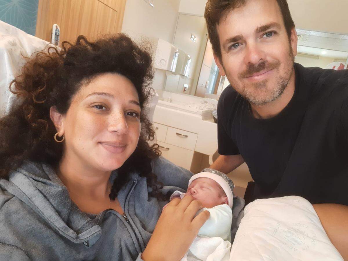 Israeli filmmaker Yahav Winner (left) with his wife Shaylee Atary and their newborn daughter Shayla. Winner was killed by Hamas when they attacked Kfar Aza in Israel.