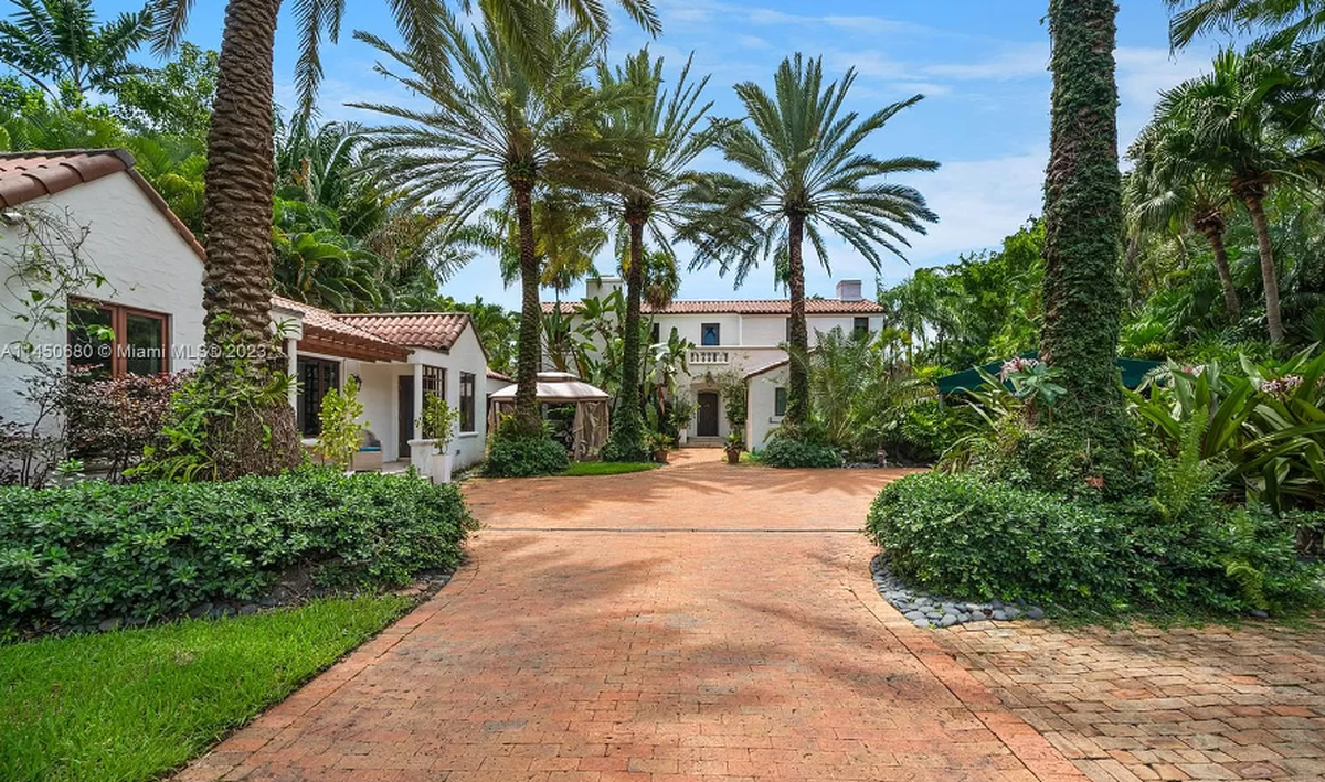 The 2-story Hibiscus Island residence has six bedrooms and seven bathrooms.