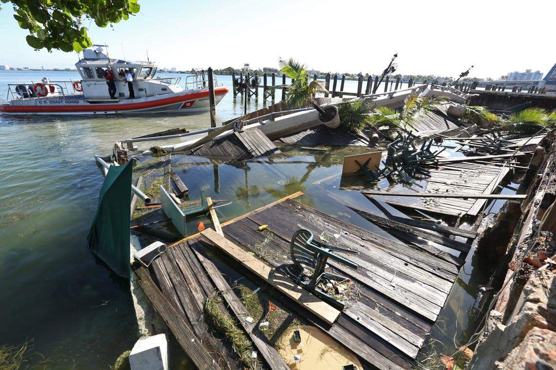 Coast Guard patrols the ares of the dock collapse last evening at Shuckers. Friday June 14, 2013.
