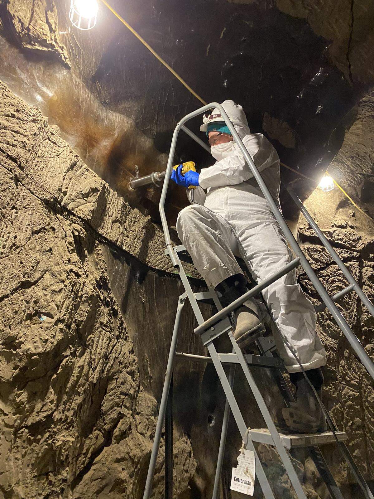 Robyn Barbato of the Cold Regions Research and Engineering Laboratory drills into subsurface ice.
