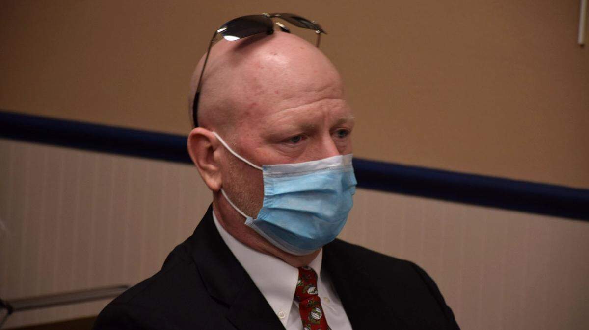 Former Marion County school administrator Michael Hickman listened at a school board hearing in October as the board decided the fate of his educational career. He was fired after losing his appeal, part of a string of public employee firings in Florida related to legal medical marijuana usage. (Christopher Cann/Fresh Take Florida)