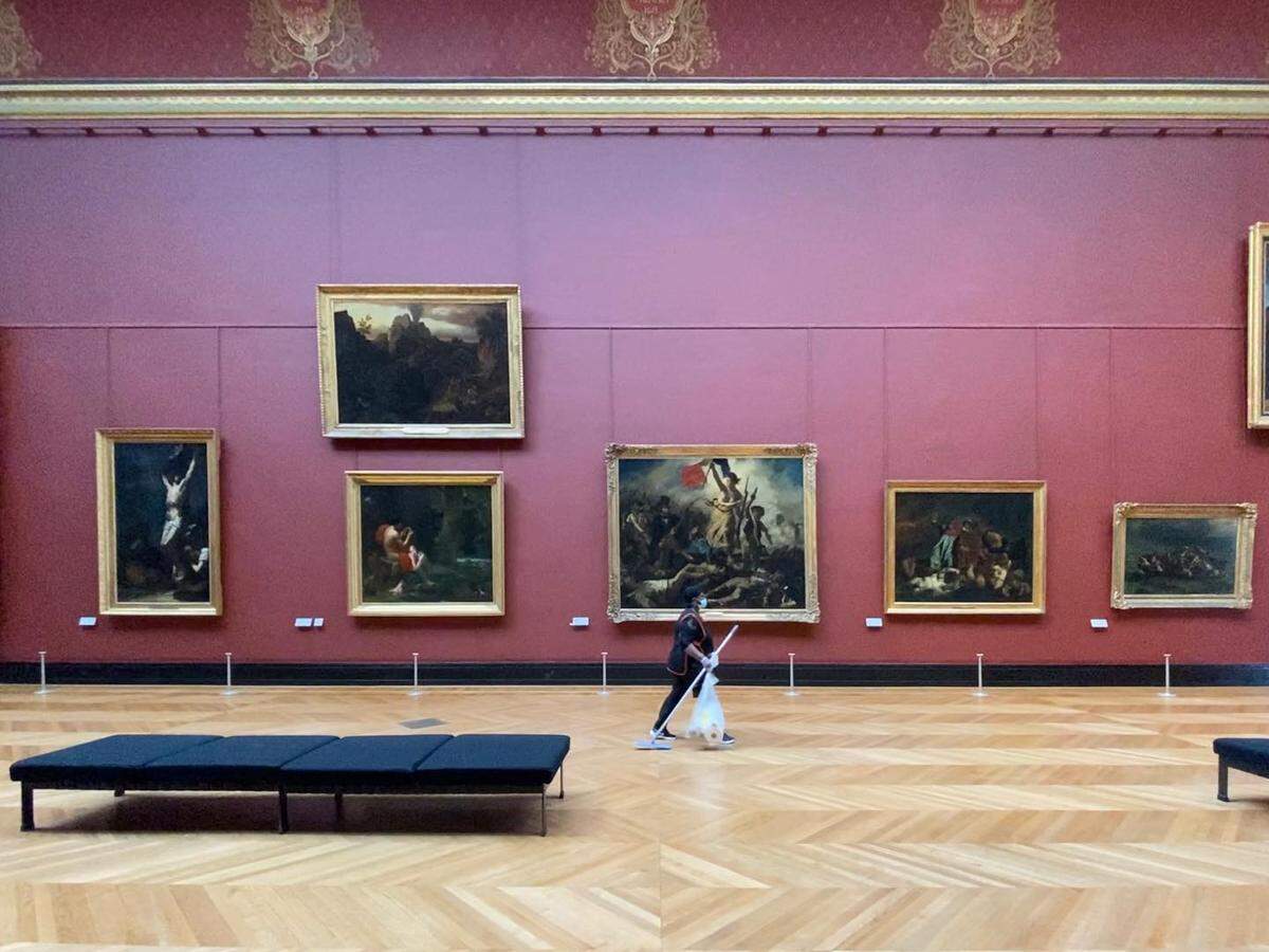 A nearly empty room in the Louvre Museum of Paris, France, photographed by Florida International University Professor John William Bailly. In the center, “Liberty Leading the People,” a painting by French artist Eugène Delacroix popularized by the 2008 Coldplay album “Viva la Vida.”
