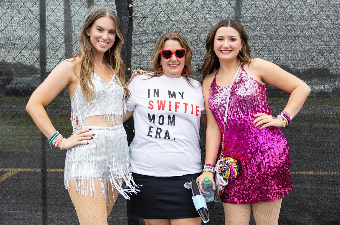 From left to right: Ashley Tremblay, 25, Michelle Miller, 45, and Keslie Miller, 20, are photographed as they arrive to Hard Rock Stadium to watch Taylor Swift’s The Eras Tour on Friday, Oct.18, 2024, in Miami Gardens, Fla.