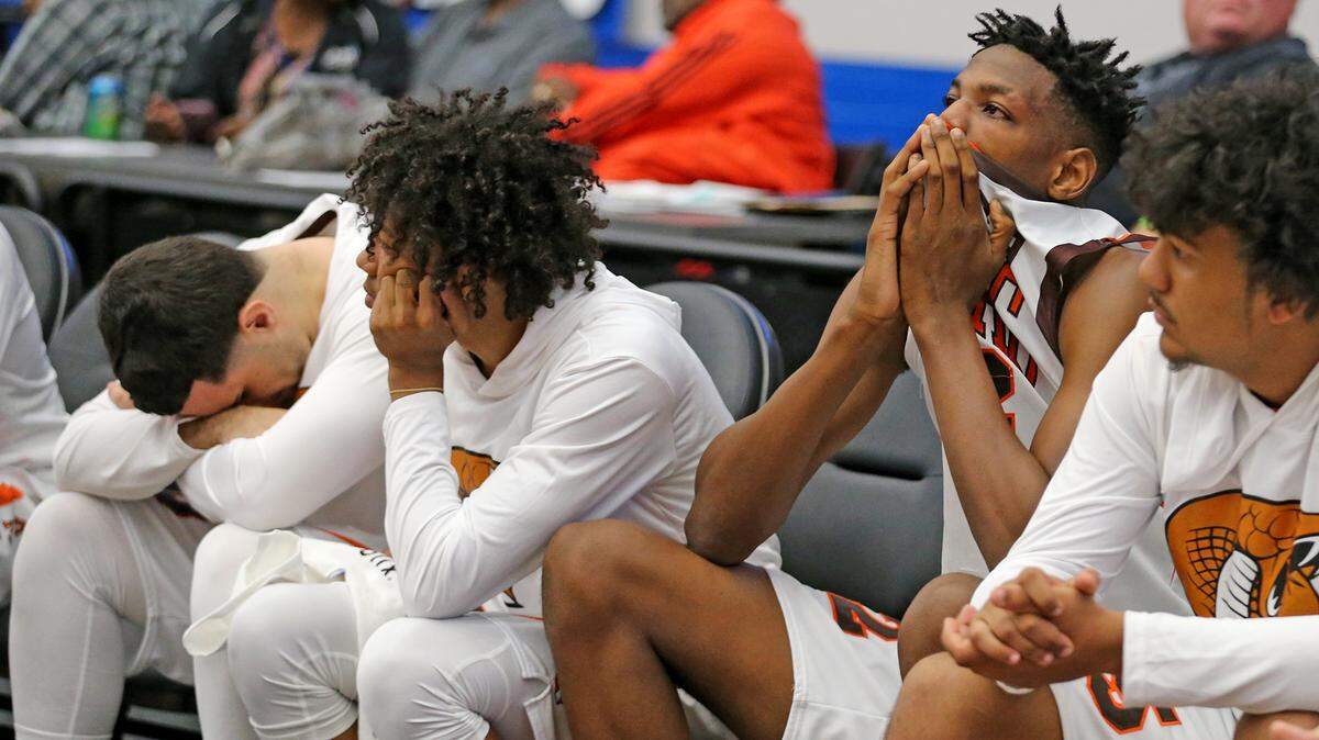 South Miami HS bench realizes they will be defeated by Osceola HS in the final seconds of the game in the 9A Boy’s Semi-Finals State Basketball Championships at the RP Funding Center in Lakeland, Florida, Friday, March, 8, 2019.