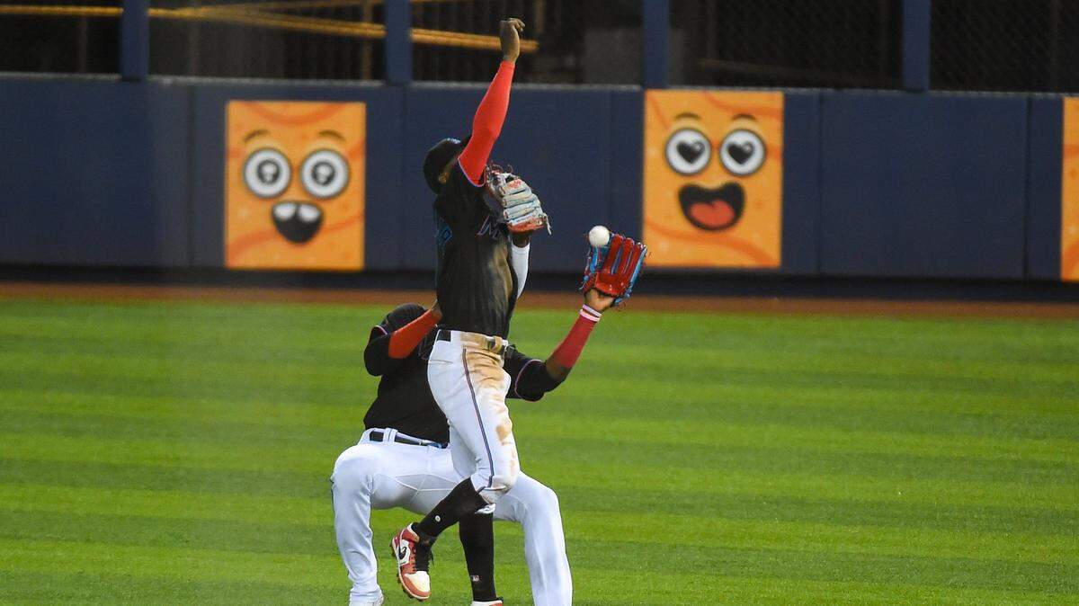 Jazz Chisholm Jr. #2 of the Miami Marlins runs into Jesus Sanchez #76 while attempting to catch a fly ball in the fourth inning against the Pittsburgh Pirates at loanDepot park on September 18, 2021 in Miami, Florida.