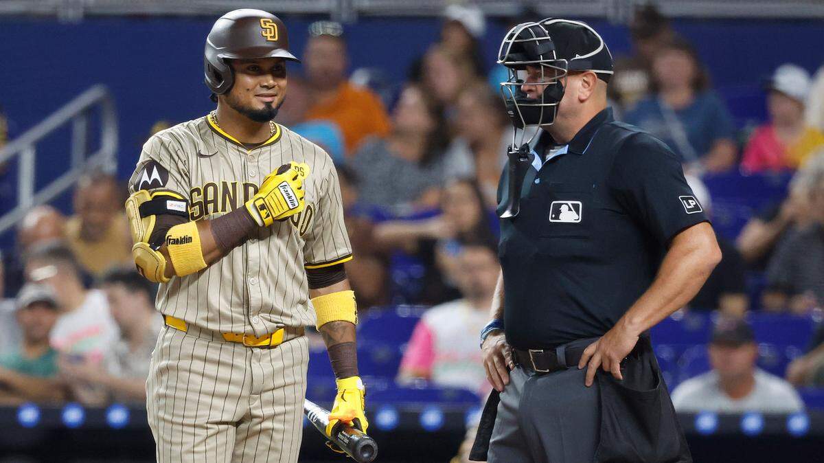 Aug 9, 2024; Miami, Florida, USA; San Diego Padres designated hitter Luis Arraez (4) acknowledges the Miami Marlins dugout in the first inning at loanDepot Park. Mandatory Credit: Rhona Wise-USA TODAY Sports