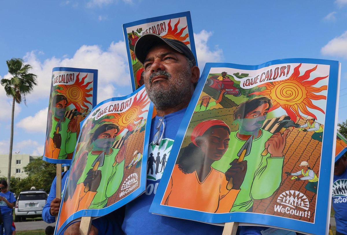 We Count! member, a membership-led organization of low-wage immigrant workers and families, Pedro Trejos along with other hold signs of the ¡Que Calor! campaign during the launching of Miami-Dade County’s Extreme Heat Action Plan. On Wednesday morning, December 14, 2022 Miami-Dade County Mayor Daniella Levine Cava, together with the Miami Foundation, launched Miami-Dade County’s Extreme Heat Action Plan, a blueprint to reduce the health and economic impacts of increasing extreme heat, and create a baseline for further research and new partnerships around this issue at Amelia Earhart Park in Hialeah, Florida.
